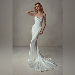 Satin Face Silk Crepe, Lined with Silk Charmeuse.